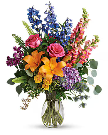 Rainbow Birthday Bouquet – vibrant mixed flower arrangement in a glass vase.